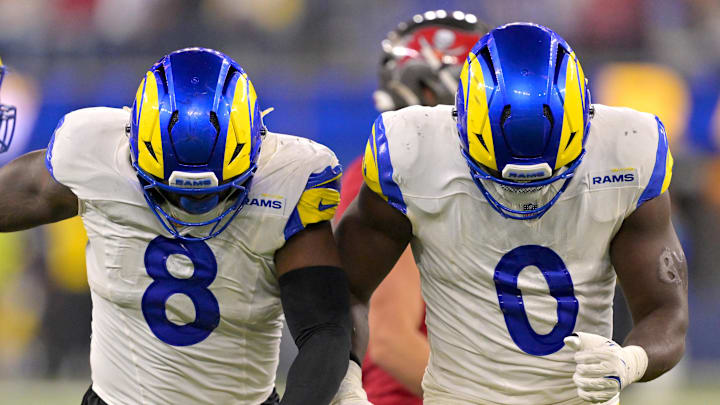 Nov 23, 2025; Inglewood, California, USA; Los Angeles Rams linebacker Jared Verse (8) and linebacker Byron Young (0) celebrate after a sack of Tampa Bay Buccaneers quarterback Teddy Bridgewater (10) in the second half at SoFi Stadium. Mandatory Credit: Jayne Kamin-Oncea-Imagn Images