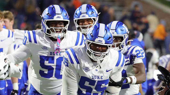 Oct 23, 2026; Charlottesville, Virginia, USA; Duke Blue Devils players celebrate after defeating the Virginia Cavaliers at Scott Stadium. Mandatory Credit: Amber Searls-Imagn Images Oct 23, 2026; Charlottesville, Virginia, USA; Duke Blue Devils players celebrate after defeating the Virginia Cavaliers at Scott Stadium. Mandatory Credit: Amber Searls-Imagn Images