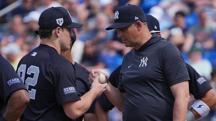  New York Yankees manager Aaron Boone and pitcher Harrison Cohen