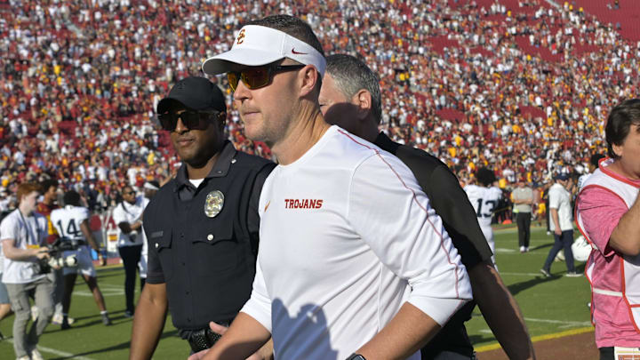 Oct 12, 2024; Los Angeles, California, USA; USC Trojans head coach Lincoln Riley walks off the field following the game against the Penn State Nittany Lions at United Airlines Field at the Los Angeles Memorial Coliseum. Mandatory Credit: Jayne Kamin-Oncea-Imagn Images