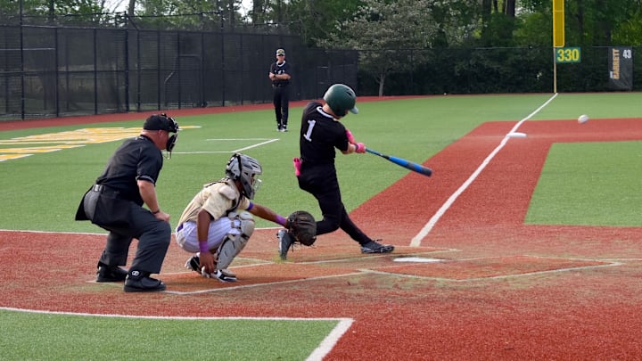 St. Xavier shortstop Jaxon Coomer makes contact with the ball Wednesday during the first inning of a game against Male.