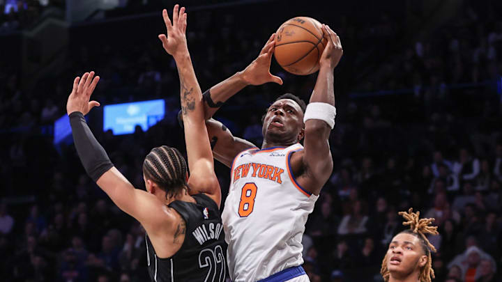 Jan 21, 2025; Brooklyn, New York, USA;  New York Knicks forward OG Anunoby (8) drives past Brooklyn Nets forward Jalen Wilson (22) in the second quarter at Barclays Center. Mandatory Credit: Wendell Cruz-Imagn Images