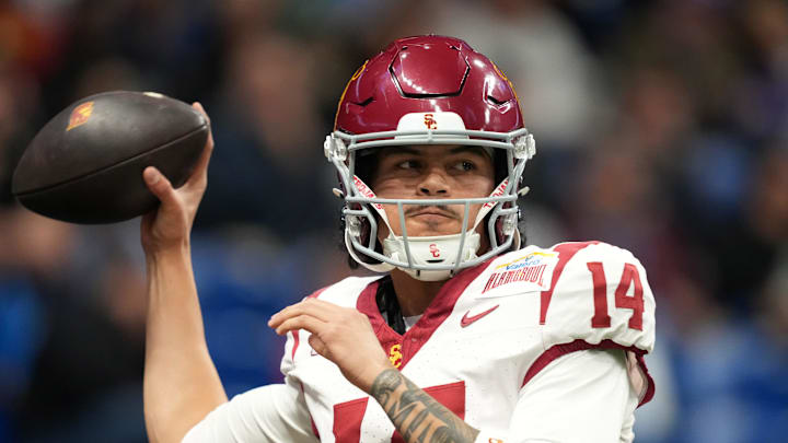 Dec 30, 2025; San Antonio, TX, USA; Southern California Trojans quarterback Jayden Maiava (14) throws the ball against the TCU Horned Frogs in the first half during the Alamo Bowl at Alamodome. Mandatory Credit: Kirby Lee-Imagn Images