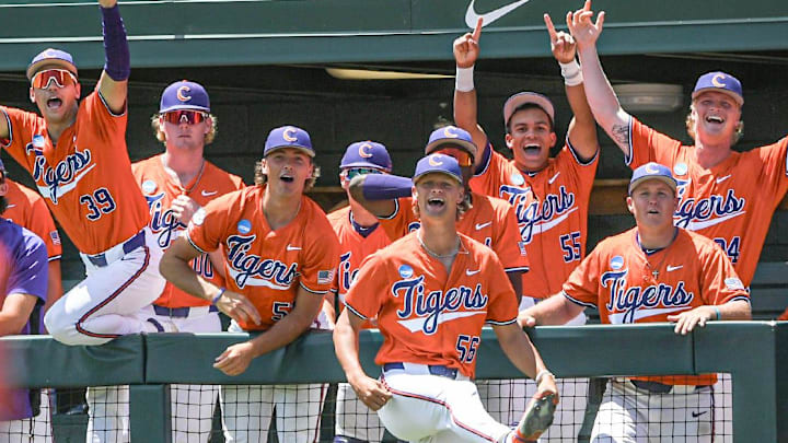 Clemson players react as Clemson freshman Jarren Purify (23) hit a triple against University of Florida during the bottom of the second inning of the NCAA baseball Clemson Super Regional at Doug Kingsmore Stadium in Clemson Saturday, June 8, 2024 Clemson players react as Clemson freshman Jarren Purify (23) hit a triple against University of Florida during the bottom of the second inning of the NCAA baseball Clemson Super Regional at Doug Kingsmore Stadium in Clemson Saturday, June 8, 2024