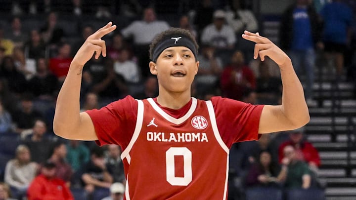 Mar 12, 2025; Nashville, TN, USA;  Oklahoma Sooners guard Jeremiah Fears (0) reacts after a three point basket  against the Georgia Bulldogs during the second half at Bridgestone Arena. Mandatory Credit: Steve Roberts-Imagn Images
