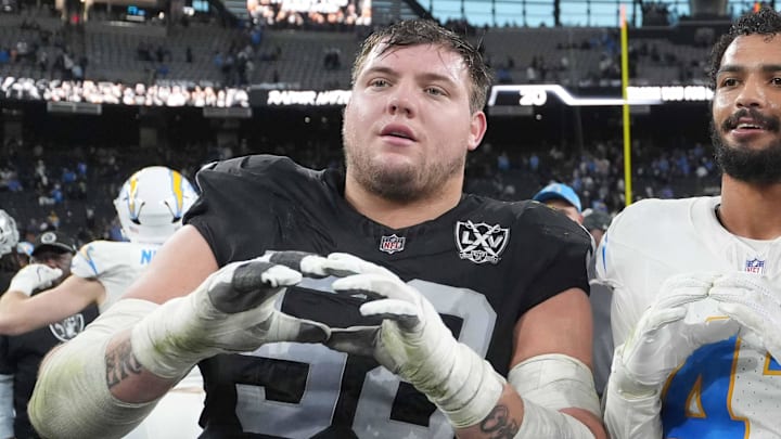 Jan 5, 2025; Paradise, Nevada, USA; Oregon Ducks former players (from left) Las Vegas Raiders guard Jackson Powers-Johnson (58) and Los Angeles Chargers linebacker Troy Dye (43) and quarterback Justin Herbert (10) pose after the game at Allegiant Stadium. Mandatory Credit: Kirby Lee-Imagn Images Jan 5, 2025; Paradise, Nevada, USA; Oregon Ducks former players (from left) Las Vegas Raiders guard Jackson Powers-Johnson (58) and Los Angeles Chargers linebacker Troy Dye (43) and quarterback Justin Herbert (10) pose after the game at Allegiant Stadium. Mandatory Credit: Kirby Lee-Imagn Images
