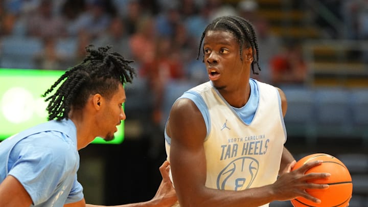 Oct 4, 2025; Charlotte, NC, USA; North Carolina Tar Heels forward Caleb Wilson (8) with the ball as forward Jarin Stevenson (15) defends in the first half at Dean E. Smith Center. Mandatory Credit: Bob Donnan-Imagn Images