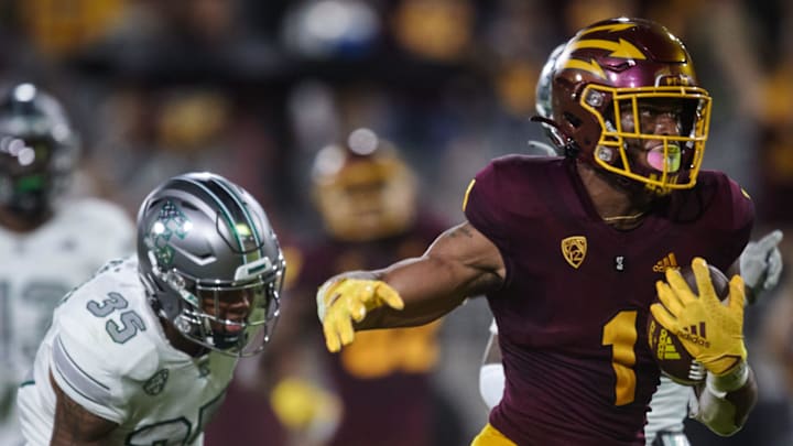 Arizona State Sun Devils running back Xazavian Valladay (1) runs the ball against Eastern Michigan Eagles defensive back Quentavius Scandrett (35) at Sun Devil Stadium in Tem