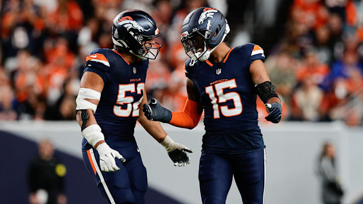 Sep 29, 2025; Denver, Colorado, USA; Denver Broncos linebacker Nik Bonitto (15) celebrates with Denver Broncos linebacker Jonah Elliss (52) after sacking Cincinnati Bengals quarterback Jake Browning (6) (not pictured) during the third quarter at Empower Field at Mile High. 