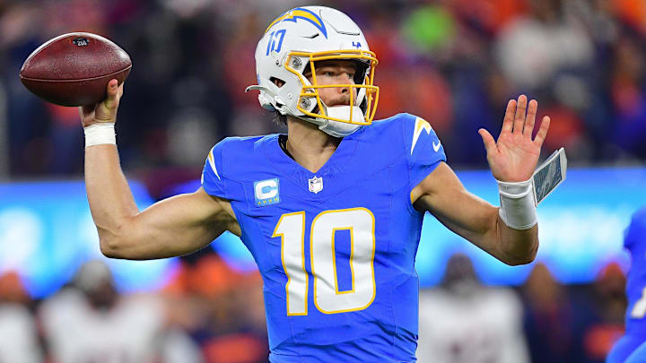 Dec 19, 2024; Inglewood, California, USA; Los Angeles Chargers quarterback Justin Herbert (10) throws against the Denver Broncos during the first half at SoFi Stadium. Mandatory Credit: Gary A. Vasquez-Imagn Images