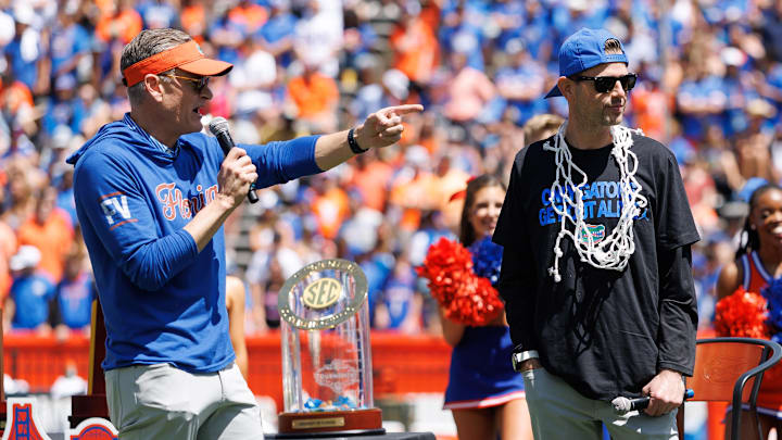 Apr 12, 2025; Gainesville, FL, USA; Florida Gators athletic director Scott Stricklin and Florida Gators head coach Todd Golden gesture during the National Championship celebration at Ben Hill Griffin Stadium. Mandatory Credit: Matt Pendleton-Imagn Images Apr 12, 2025; Gainesville, FL, USA; Florida Gators athletic director Scott Stricklin and Florida Gators head coach Todd Golden gesture during the National Championship celebration at Ben Hill Griffin Stadium. Mandatory Credit: Matt Pendleton-Imagn Images
