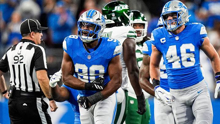 Detroit Lions edge rusher DJ Wonnum (98) celebrates a sack of New York Jets quarterback Geno Smith (7) 