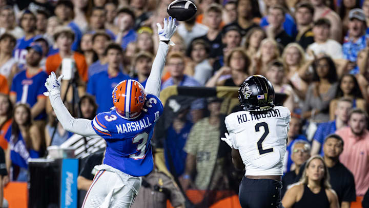 Oct 5, 2024; Gainesville, Florida, USA; Florida Gators defensive back Jason Marshall Jr. (3) breaks up a pass to UCF Knights wide receiver Kobe Hudson (2) during the first half at Ben Hill Griffin Stadium. Mandatory Credit: Matt Pendleton-Imagn Images