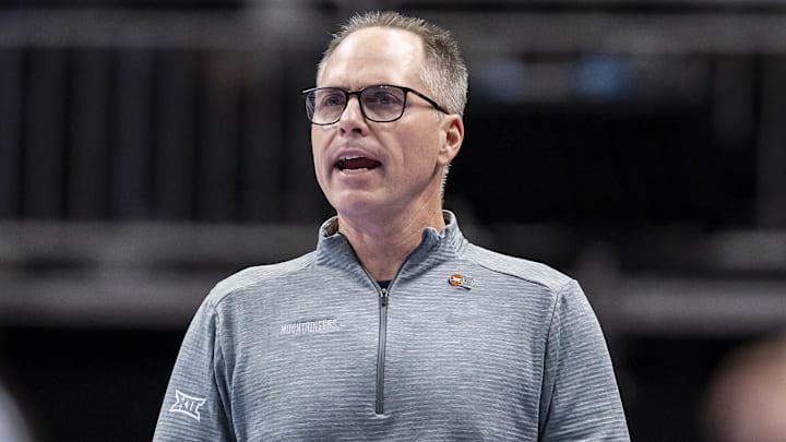 Mar 6, 2026; Kansas City, MO, USA; West Virginia head coach Mark Kellogg watches the run of play against Arizona State during the first half at T-Mobile Center. Mandatory Credit: Nick Tre. Smith-Imagn Images