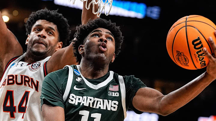 Michigan State guard Jase Richardson (11) goes to the basket against Auburn center Dylan Cardwell (44) during the second half of the Elite Eight round of NCAA tournament at State Farm Arena in Atlanta, Ga. on Sunday, March 30, 2025. Michigan State guard Jase Richardson (11) goes to the basket against Auburn center Dylan Cardwell (44) during the second half of the Elite Eight round of NCAA tournament at State Farm Arena in Atlanta, Ga. on Sunday, March 30, 2025.
