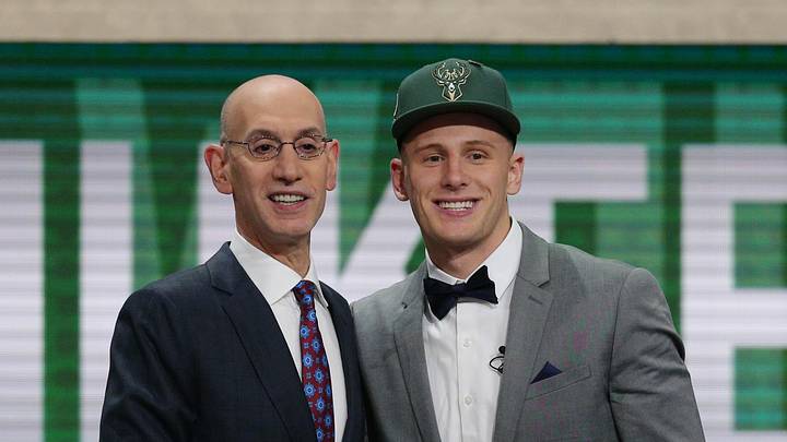 Donte DiVincenzo greets NBA commissioner Adam Silver after being selected as the seventeenth overall pick to the Milwaukee Bucks in the first round of the 2018 NBA Draft.