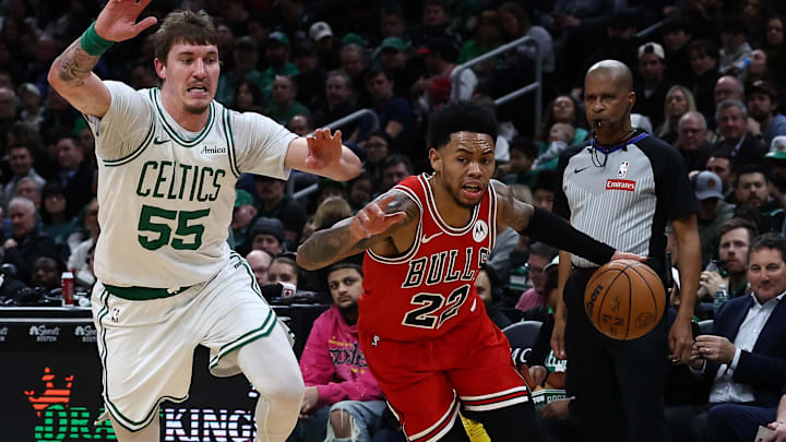 Feb 11, 2026; Boston, Massachusetts, USA; Chicago Bulls guard Anfernee Simons (22) drives past Boston Celtics guard Baylor Scheierman (55) during the second half at TD Garden. Mandatory Credit: Winslow Townson-Imagn Images