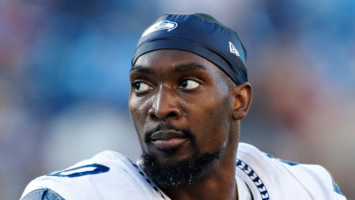 DeMarcus Lawrence of the Seattle Seahawks looks at the scoreboard DeMarcus Lawrence of the Seattle Seahawks looks at the scoreboard