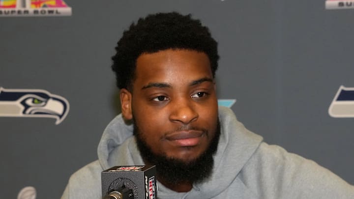 Seattle Seahawks cornerback Devon Witherspoon speaks to the media