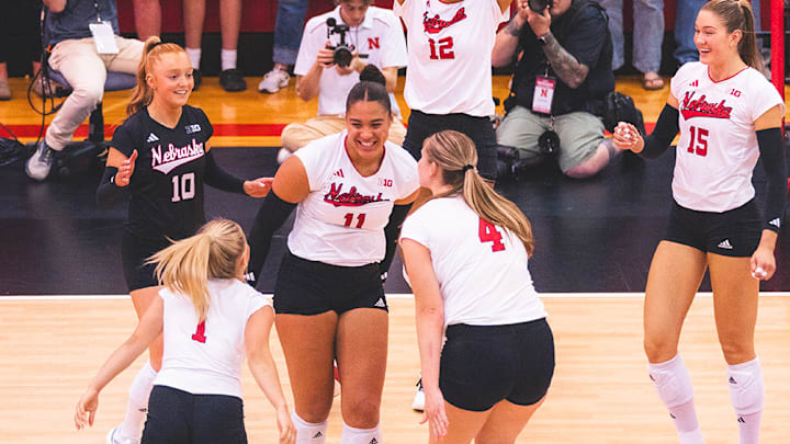 Nebraska volleyball players celebrate during their 4-0 exhibition win Saturday over South Dakota State at Ord High School.