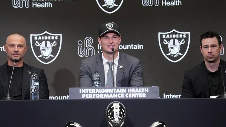 Apr 24, 2026; Henderson, NV, USA; Las Vegas Raiders quarterback Fernando Mendoza (center) speaks at introductory press conference at Intermountain Health Performance Center flanked by general manager John Spytek (left) and head coach Klint Kubiak after being selected as the No. 1 pick in the 2026 NFL Draft. Mandatory Credit: Kirby Lee-Imagn Images Apr 24, 2026; Henderson, NV, USA; Las Vegas Raiders quarterback Fernando Mendoza (center) speaks at introductory press conference at Intermountain Health Performance Center flanked by general manager John Spytek (left) and head coach Klint Kubiak after being selected as the No. 1 pick in the 2026 NFL Draft. Mandatory Credit: Kirby Lee-Imagn Images