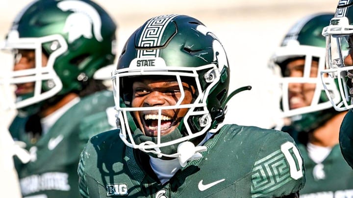 Michigan State's Charles Brantley, left, celebrates with Ken Talley after an interception against Prairie View A&M during the second quarter on Saturday, Sept. 14, 2024, at Spartan Stadium in East Lansing. Brantley's interception was called back on a penalty.