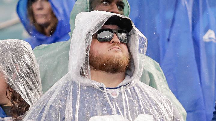 Indianapolis Colts fans stand in the rain Indianapolis Colts fans stand in the rain