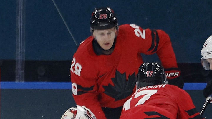 Feb 13, 2026; Milan, Italy; Macklin Celebrini and Nathan MacKinnon of Canada in action with Akira Schmid and Dean Kukan of Switzerland in men's ice hockey group A play during the Milano Cortina 2026 Olympic Winter Games at Milano Santagiulia Ice Hockey Arena. Mandatory Credit: Geoff Burke-Imagn Images Feb 13, 2026; Milan, Italy; Macklin Celebrini and Nathan MacKinnon of Canada in action with Akira Schmid and Dean Kukan of Switzerland in men's ice hockey group A play during the Milano Cortina 2026 Olympic Winter Games at Milano Santagiulia Ice Hockey Arena. Mandatory Credit: Geoff Burke-Imagn Images