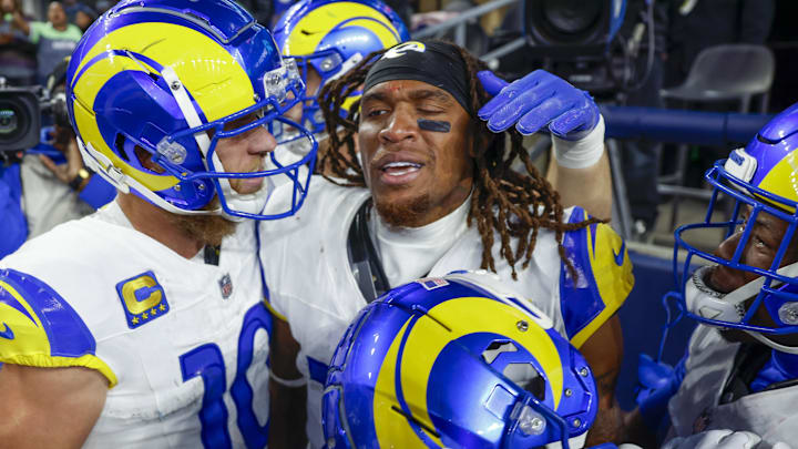 Nov 3, 2024; Seattle, Washington, USA; Los Angeles Rams wide receiver Demarcus Robinson (15, middle) celebrates with teammates, including wide receiver Cooper Kupp (10, left), after catching a game-wining touchdown pass against the Seattle Seahawks during overtime at Lumen Field. Mandatory Credit: Joe Nicholson-Imagn Images Nov 3, 2024; Seattle, Washington, USA; Los Angeles Rams wide receiver Demarcus Robinson (15, middle) celebrates with teammates, including wide receiver Cooper Kupp (10, left), after catching a game-wining touchdown pass against the Seattle Seahawks during overtime at Lumen Field. Mandatory Credit: Joe Nicholson-Imagn Images