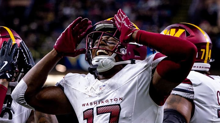 Dec 15, 2024; New Orleans, Louisiana, USA;  Washington Commanders wide receiver Terry McLaurin (17) reacts to scoring a touchdown against the New Orleans Saints during the first half at Caesars Superdome. Mandatory Credit: Stephen Lew-Imagn Images
