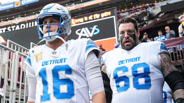 Detroit Lions quarterback Jared Goff and former left tackle Taylor Decker walk out from the tunnel pregame 