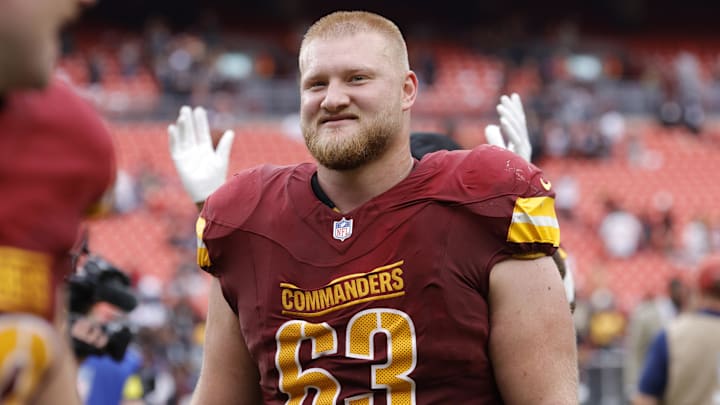 Sep 21, 2025; Landover, Maryland, USA; Washington Commanders center Tyler Biadasz (63) walks off the field after the game against the Las Vegas Raiders at Northwest Stadium. Mandatory Credit: Amber Searls-Imagn Images
