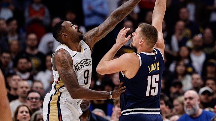 Oct 29, 2025; Denver, Colorado, USA; Denver Nuggets center Nikola Jokic (15) shoots the ball under pressure from New Orleans Pelicans center DeAndre Jordan (9) in the first quarter at Ball Arena. Mandatory Credit: Isaiah J. Downing-Imagn Images Oct 29, 2025; Denver, Colorado, USA; Denver Nuggets center Nikola Jokic (15) shoots the ball under pressure from New Orleans Pelicans center DeAndre Jordan (9) in the first quarter at Ball Arena. Mandatory Credit: Isaiah J. Downing-Imagn Images