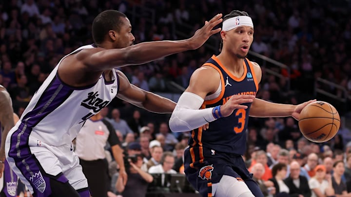 Apr 4, 2024; New York, New York, USA; New York Knicks guard Josh Hart (3) controls the ball against Sacramento Kings forward Harrison Barnes (40) during the second quarter at Madison Square Garden. Mandatory Credit: Brad Penner-Imagn Images