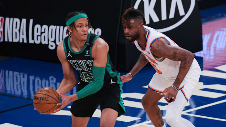 May 16, 2021; New York, New York, USA; Boston Celtics guard Romeo Langford (45) holds the ball against New York Knicks forward Reggie Bullock (25) during the second half at Madison Square Garden. Mandatory Credit: Vincent Carchietta-Imagn Images
