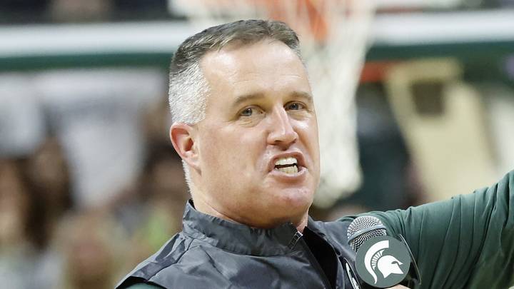 Michigan State Spartans head football coach Pat Fitzgerald points while introducing himself to the crowd at a men's basketball game against the Iowa Hawkeyes on Tuesday, Dec. 2, 2025. Fitzgerald was officially hired by MSU on Monday. Michigan State Spartans head football coach Pat Fitzgerald points while introducing himself to the crowd at a men's basketball game against the Iowa Hawkeyes on Tuesday, Dec. 2, 2025. Fitzgerald was officially hired by MSU on Monday.