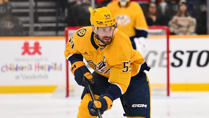 Jan 11, 2026; Nashville, Tennessee, USA;  Nashville Predators defenseman Roman Josi (59) skates with the puck against the Washington Capitals during the first period at Bridgestone Arena. Mandatory Credit: Steve Roberts-Imagn Images