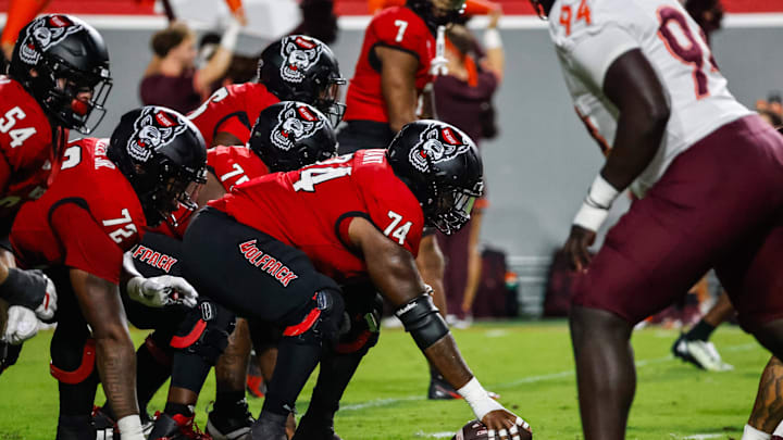 Sep 27, 2025; Raleigh, North Carolina, USA;  North Carolina State Wolfpack offensive lineman Jalen Grant (74) with the ball during the first half of the game against Virginia Tech Hokies at Carter-Finley Stadium. Mandatory Credit: Jaylynn Nash-Imagn Images