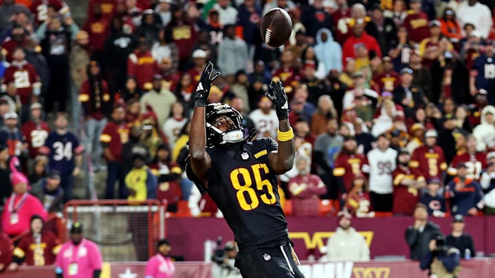 Oct 27, 2024; Landover, Maryland, USA; Washington Commanders wide receiver Noah Brown (85) catches a Hail Mary pass with no time left to beat the Chicago Bears at Commanders Field. Mandatory Credit: Peter Casey-Imagn Images