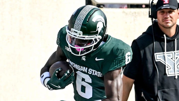 Michigan State's Nick Marsh, top, catches a pass as Youngstown State's Makai Shahid closes in during the first quarter on Saturday, Sept. 13, 2025, at Spartan Stadium in East Lansing.