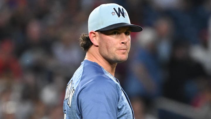 Jun 6, 2025; Washington, District of Columbia, USA; Washington Nationals relief pitcher Kyle Finnegan (67) reacts after an error at first base during the ninth inning against the Texas Rangers at Nationals Park Jun 6, 2025; Washington, District of Columbia, USA; Washington Nationals relief pitcher Kyle Finnegan (67) reacts after an error at first base during the ninth inning against the Texas Rangers at Nationals Park