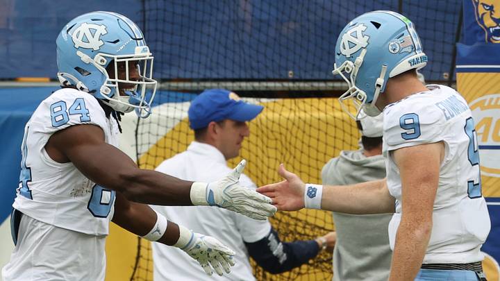 Oct 10, 2026; Pittsburgh, Pennsylvania, USA; North Carolina Tar Heels tight end Shamar Easter (84) and quarterback Billy Edwards Jr. (9) celebrate a touchdown against the Pittsburgh Panthers during the fourth quarter at Acrisure Stadium. Mandatory Credit: Charles LeClaire-Imagn Images Oct 10, 2026; Pittsburgh, Pennsylvania, USA; North Carolina Tar Heels tight end Shamar Easter (84) and quarterback Billy Edwards Jr. (9) celebrate a touchdown against the Pittsburgh Panthers during the fourth quarter at Acrisure Stadium. Mandatory Credit: Charles LeClaire-Imagn Images