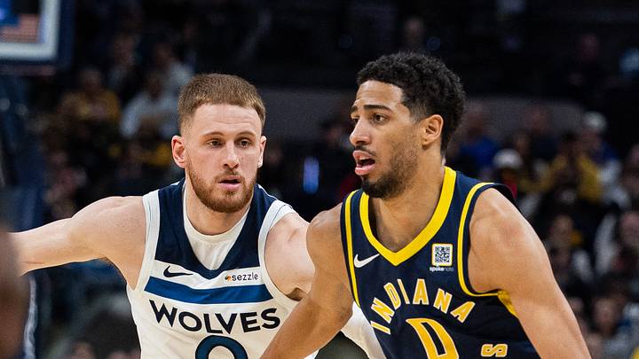 Mar 24, 2025; Indianapolis, Indiana, USA; Indiana Pacers guard Tyrese Haliburton (0) dribbles the ball while Minnesota Timberwolves guard Donte DiVincenzo (0) defends in the second half at Gainbridge Fieldhouse. Mandatory Credit: Trevor Ruszkowski-Imagn Images
