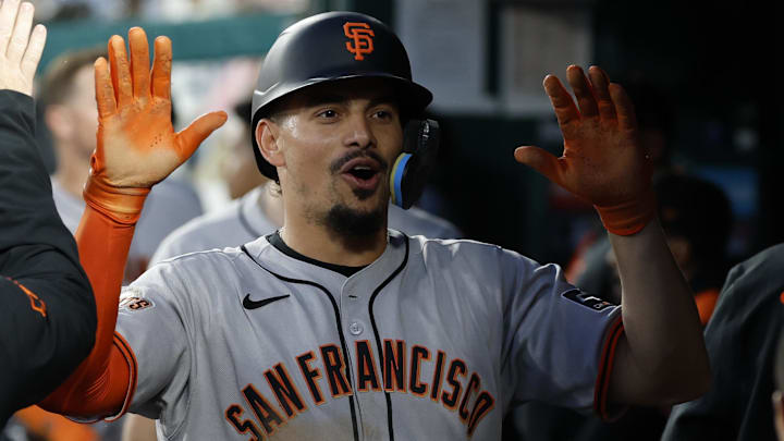 May 23, 2025; Washington, District of Columbia, USA; San Francisco Giants shortstop Willy Adames (2) celebrates with teammates in the dugout after scoring a run on a bases loaded walk against the Washington Nationals during the seventh inning at Nationals Park. 