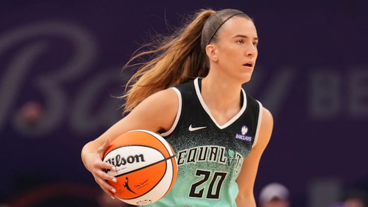Sep 19, 2025; Phoenix, Arizona, USA; New York Liberty guard Sabrina Ionescu (20) dribbles against the Phoenix Mercury during the first half of game three of round one for the 2025 WNBA Playoffs at PHX Arena. Mandatory Credit: Joe Camporeale-Imagn Images