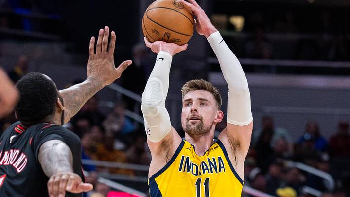Apr 10, 2026; Indianapolis, Indiana, USA; Indiana Pacers center Micah Potter (11) shoots for the basket against Philadelphia 76ers center Andre Drummond (1) during the first half at Gainbridge Fieldhouse. Mandatory Credit: Trevor Ruszkowski-Imagn Images