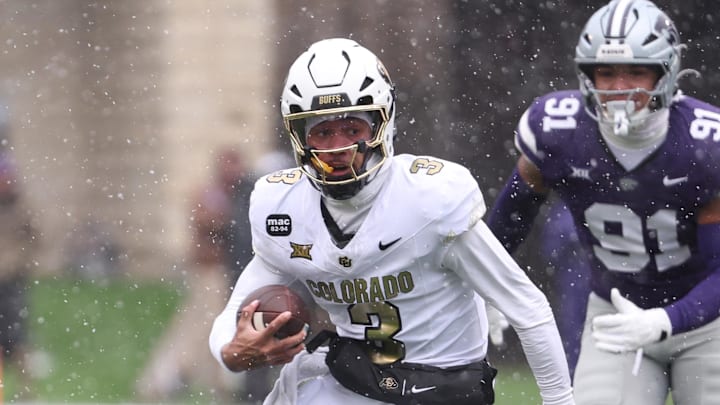 Nov 29, 2025; Manhattan, Kansas, USA; Colorado Buffaloes quarterback Kaidon Salter (3) runs by Kansas State Wildcats defensive end Jordan Allen (91) during the first quarter at Bill Snyder Family Football Stadium. Mandatory Credit: Scott Sewell-Imagn Images
