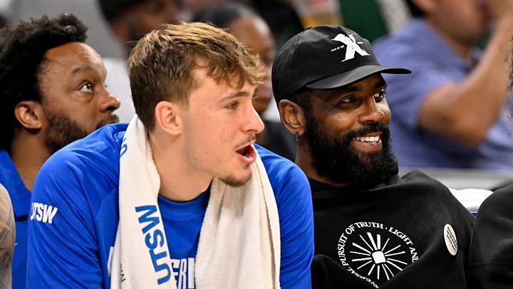 Oct 6, 2025; Fort Worth, Texas, USA; Dallas Mavericks forward Cooper Flagg (left) and guard Kyrie Irving (right) watch the game against the Oklahoma City Thunder during the second half at Dickie's Arena. Mandatory Credit: Jerome Miron-Imagn Images Oct 6, 2025; Fort Worth, Texas, USA; Dallas Mavericks forward Cooper Flagg (left) and guard Kyrie Irving (right) watch the game against the Oklahoma City Thunder during the second half at Dickie's Arena. Mandatory Credit: Jerome Miron-Imagn Images