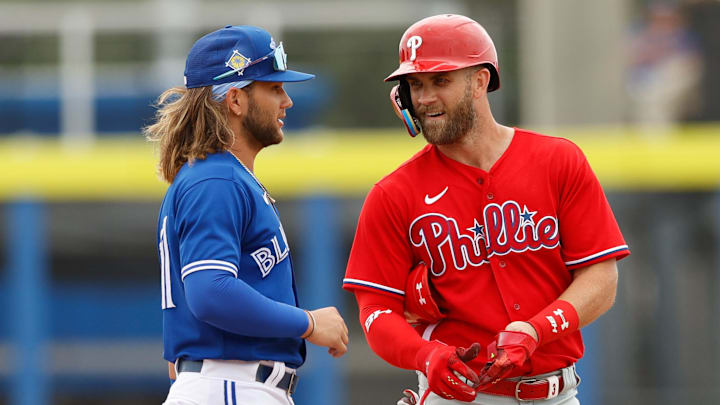 Apr 2, 2022; Dunedin, Florida, USA; Philadelphia Phillies right fielder Bryce Harper (3) interacts with Toronto Blue Jays shortstop Bo Bichette (11) after htitting a double in the first inning during spring training at TD Ballpark. Mandatory Credit: Nathan Ray Seebeck-Imagn Images Apr 2, 2022; Dunedin, Florida, USA; Philadelphia Phillies right fielder Bryce Harper (3) interacts with Toronto Blue Jays shortstop Bo Bichette (11) after htitting a double in the first inning during spring training at TD Ballpark. Mandatory Credit: Nathan Ray Seebeck-Imagn Images