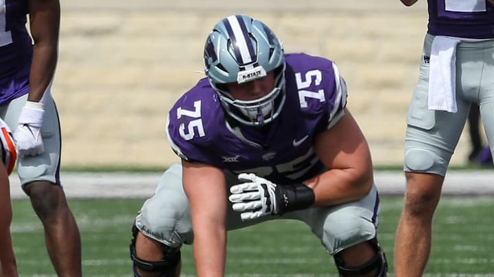 Sep 28, 2024; Manhattan, Kansas, USA; Kansas State Wildcats quarterback Avery Johnson (2) waits for the snap from center Sam Hecht (75) against the Oklahoma State Cowboys during the fourth quarter at Bill Snyder Family Football Stadium. Mandatory Credit: Scott Sewell-Imagn Images